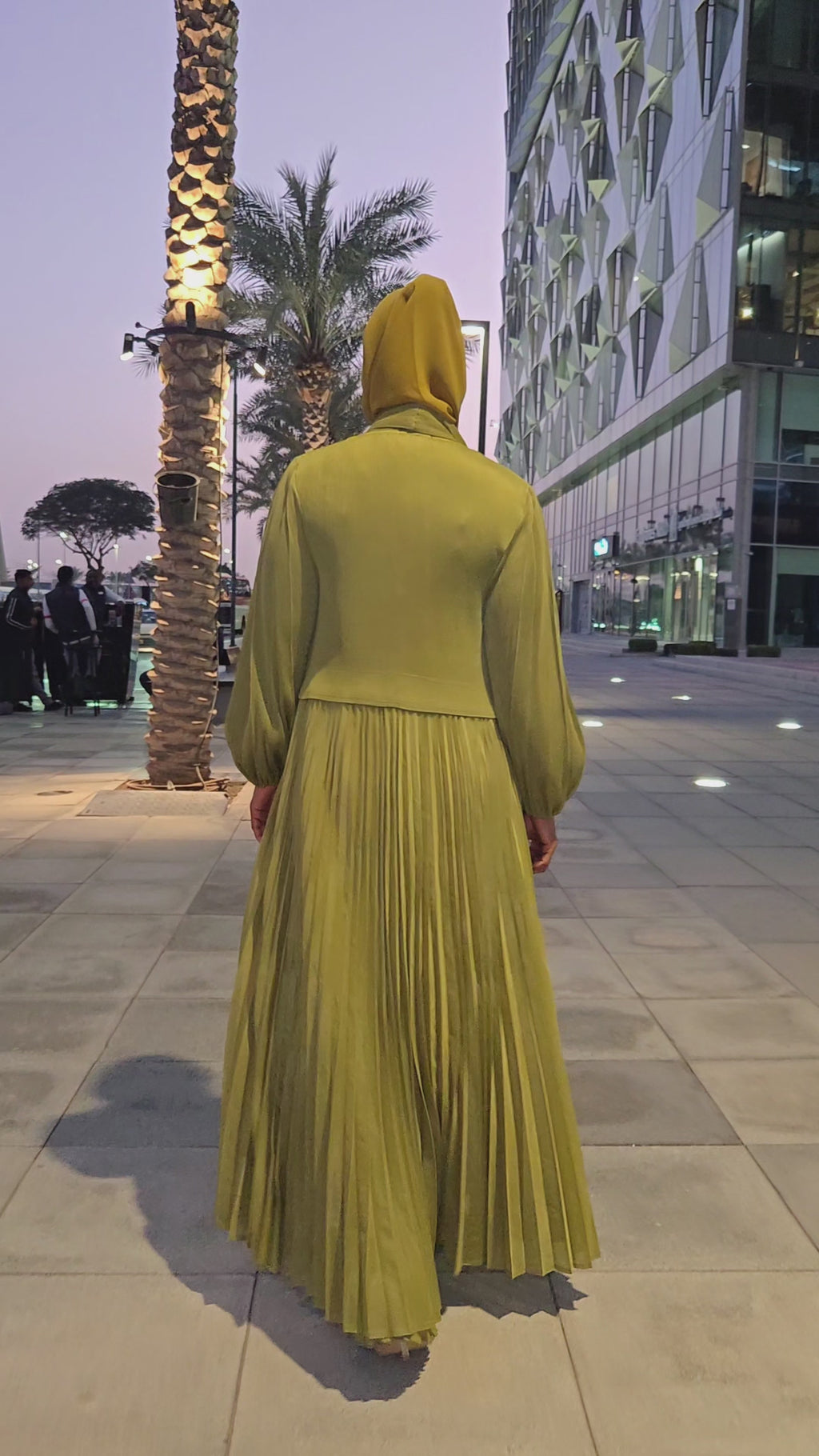 Olive Aura Plissé Abaya in moss green with balloon sleeves and micro-pleated fabric